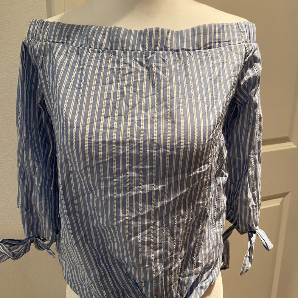 Blue off the shoulder shirt with white pinstripes